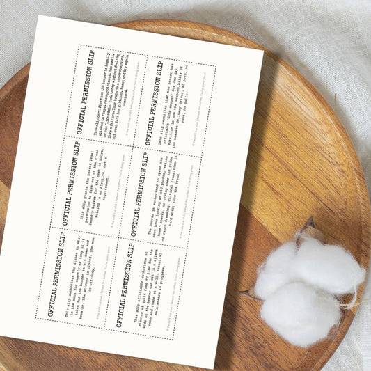 Sheet of paper with printed text on a wooden surface with cotton balls.